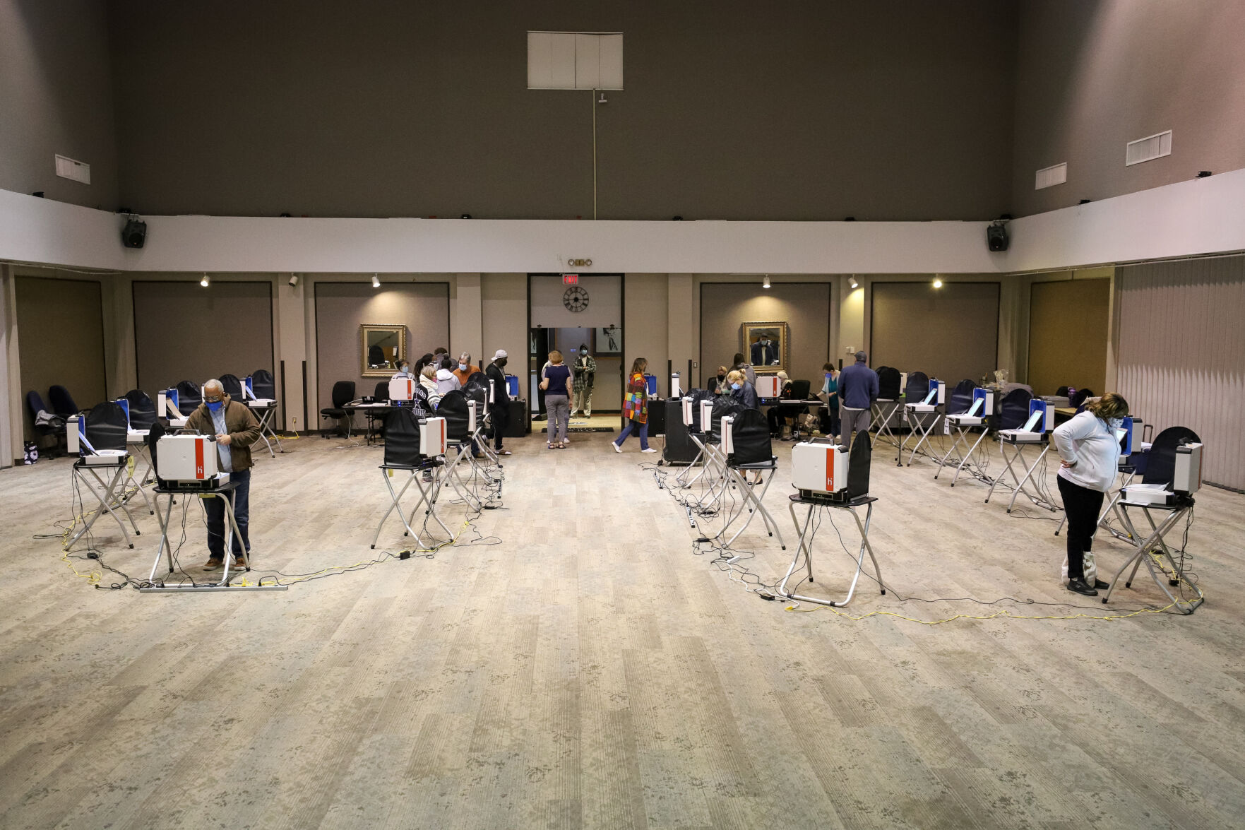 Photos: Metroplex voters brave cold weather at the polls, businesses board windows on Election Day